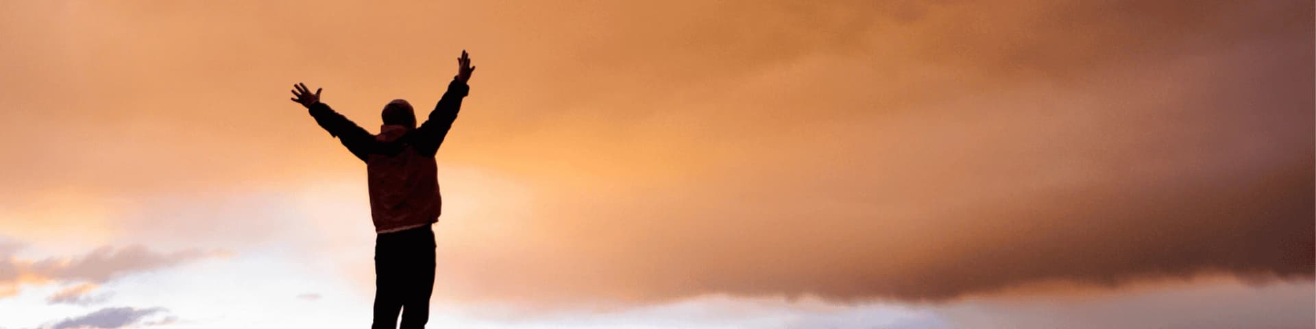 How to Make the 12 Steps of AA Work for You A man raising his hands in victory as he fulfills the 12 steps